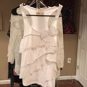 The cutest white ruffle with a bow Hollister tank!